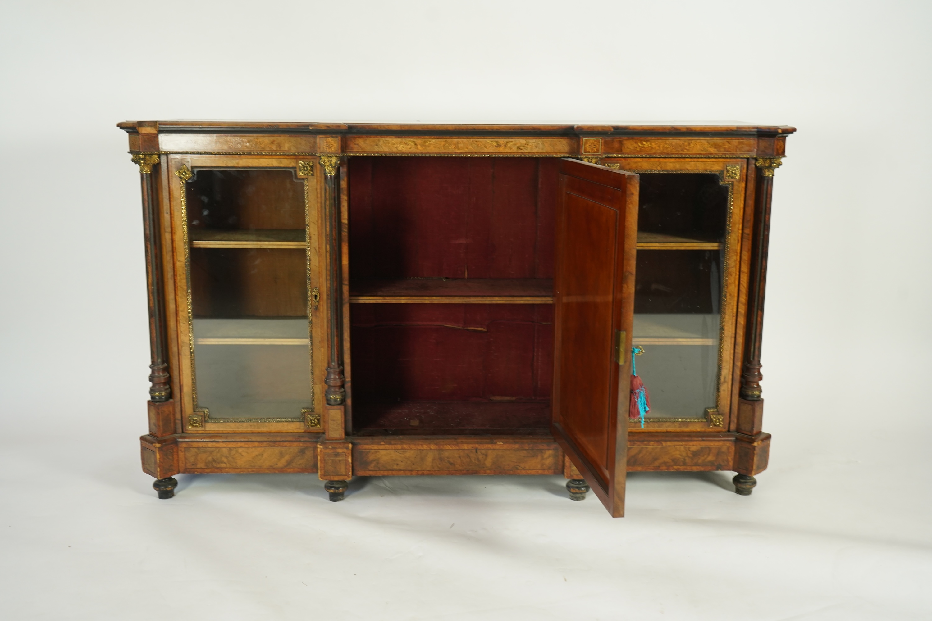 A Victorian birds eye maple banded, gilt metal mounted figured walnut side cabinet